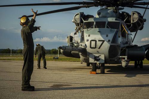 U.S. Marines conduct maintenance on a CH-53E Super Stallion