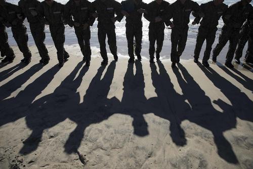 U.S. Navy SEAL candidates participate in BUD/S training.