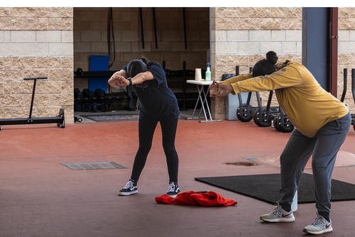 Marines stretch during a fitness program designed for pregnant service members at Camp Pendleton, California.