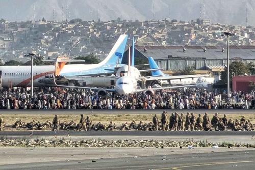 Coalition forces form a security perimeter at Kabul International Airport