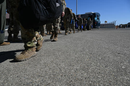 U.S. Air Force airmen step onto the flightline to catch a flight at Beale Air Force Base, California.