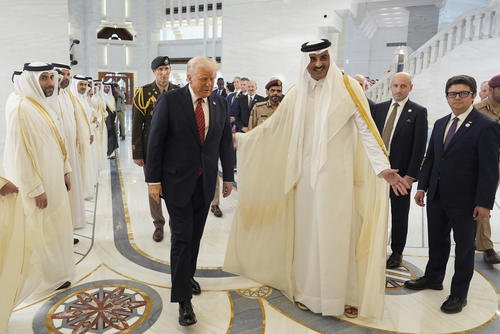 Qatar's Emir Sheikh Tamim bin Hamad Al Thani welcomes President Trump