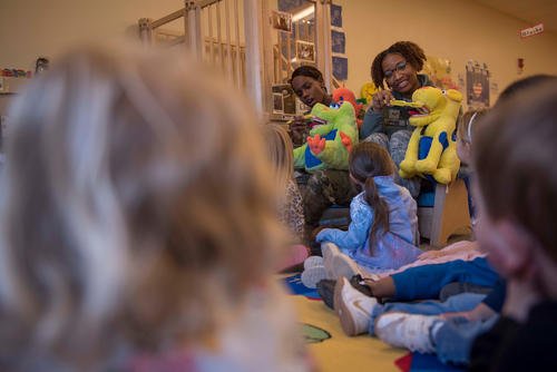 Child tests her brushing techniques on a stuffed animal