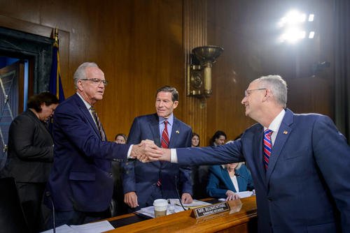 Committee Chairman Sen. Jerry Moran, R-Kan., left, and ranking member Sen. Richard Blumenthal, D-Conn., center, greet Secretary of Veterans Affairs Doug Collins during a Senate Committee on Veterans Affairs hearing to examine veterans at the forefront, focusing on the future at the U.S. Department of Veterans Affairs, on Capitol Hill, Tuesday, May 6, 2025, in Washington.