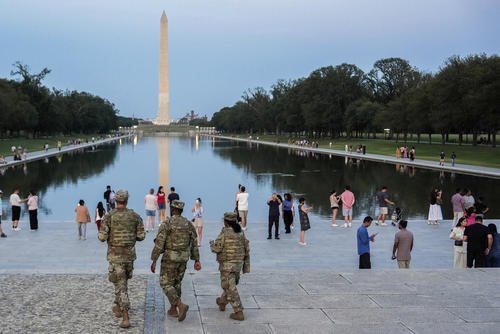 Members of the District of Columbia National Guard patrol along the National Mall.