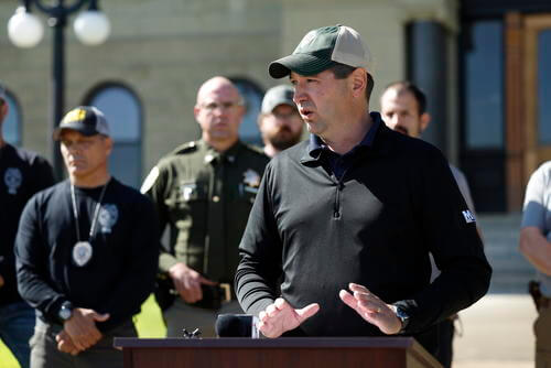 Montana Attorney General Austin Knudsen speaks to the media