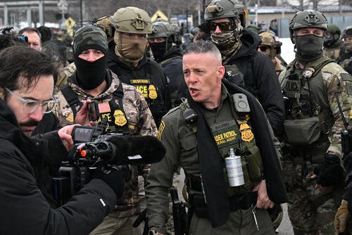 U.S. Border Patrol Cmdr. Gregory Bovino arrives as protesters gather outside the Bishop Henry Whipple Federal Building, Thursday, Jan. 8, 2026, in Minneapolis, Minn. (AP Photo/Tom Baker)
