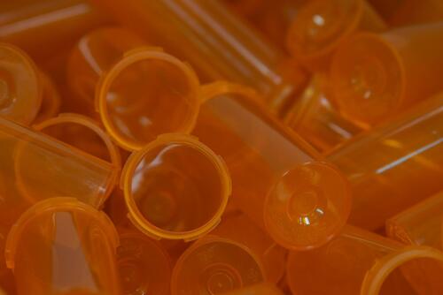 Jumble of orange pill bottles.