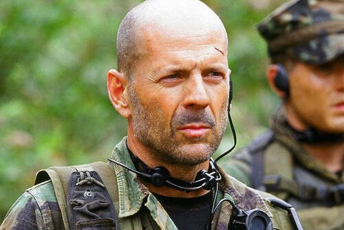 Bruce Willis in military gear in Tears of the Sun, actor who grew up in a military family. (Photo courtesy of Sony Pictures Releasing)